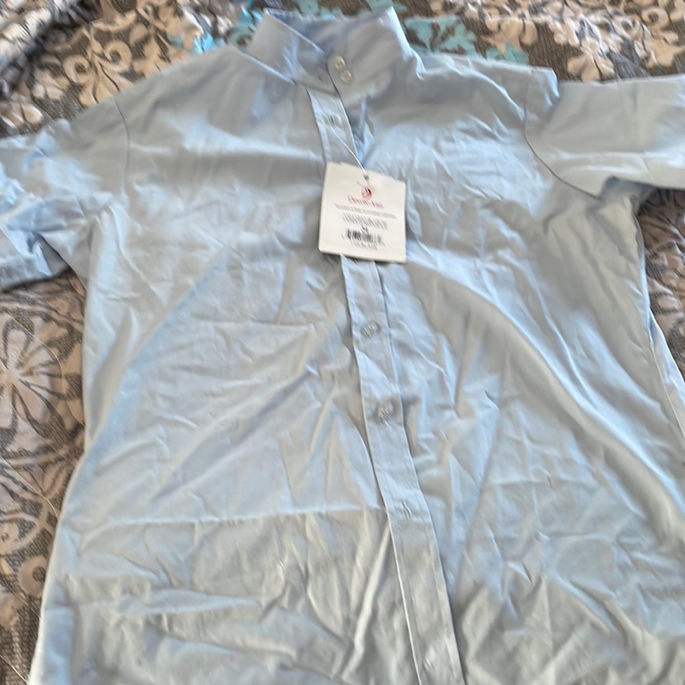 Woman’s size 34 show shirt for horse shows.  Light blue with tags